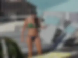 Hot milf sunbathing in a thong by pool and swimming
