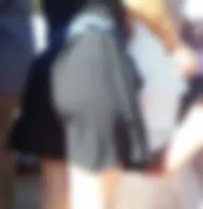 Hot booty in a skirt and nice pale slim legs on the street closeup