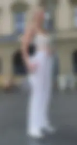 Long blonde braless in a white outfit (many pictures)