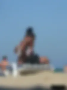 Hot ass topless beach girl with great tits lets her little brother oil up her ass in thong bikini