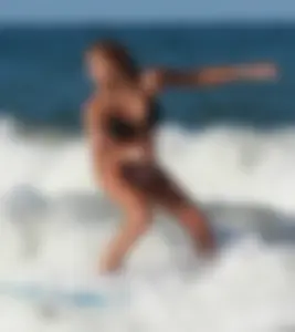 Hot surfer chicks out in the water