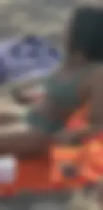 Sexy Candid Girl in a Green Swimsuit Lying on the Beach, Closeups of Her Ass