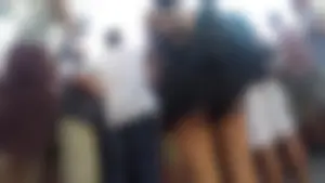 Latina babe in loose shorts showing her ass cheeks