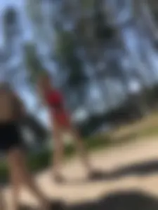 Young Girl in a One-Piece Swimsuit Walking on a Forest Road Photo Gallery
