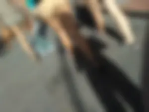 Brunette ass cheeks in short yellow shorts