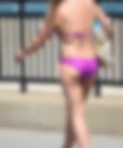 Sexy thick blonde girl in purple bikini