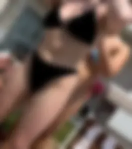 Hot babes in bikinis by pool