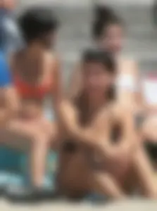 Bunch of sexy babes at the beach in bikinis