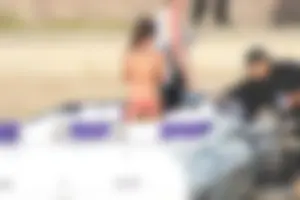 Brunette on a boat in red thong bikini with a tight little ass