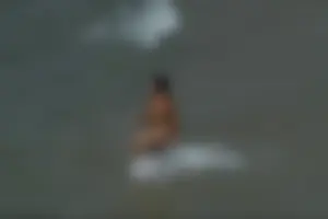 Girls on a nude beach in Sitges, Spain
