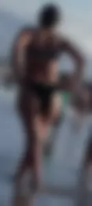 Milf with a big booty in a bikini at the beach