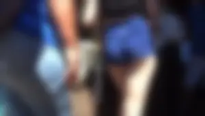A sexy girl at Disney Land in short blue shorts showing her ass cheeks