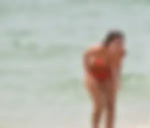 Two sexy ass girls on the beach in bikinis