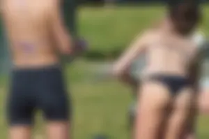 Girl Sunbathing in the City Park in Swimsuit Candid