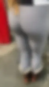 Amazing teen wearing grey leggings at the supermarket