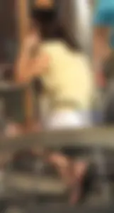 Lady in flop flops while eating showing her feet