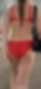 Beauty picks at her bikini wedgie