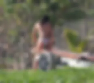 A sexy brunette and sexy blonde in bikinis at the beach