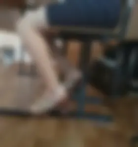 College Teen in a Skirt And High-Heeled Sandals Sitting in Class at the Desk With Crossed Legs, Under Desk Creepshots