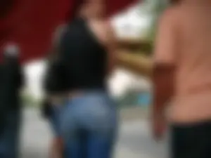 Red haired lady with a nice ass in tight jeans waiting for the bus