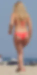 Sexy thick blonde girl with tiny bikini and big booty on the beach