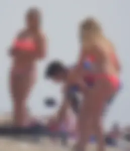 Sexy thick blonde girl with tiny bikini and big booty on the beach