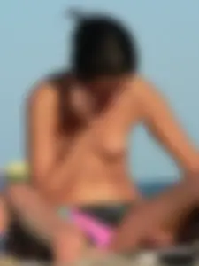 Sexy girls going topless at the beach showing off their sexy bodies