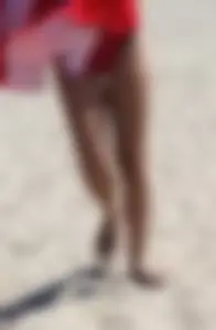 Candid beach Asian with a sexy little ass in a red swimsuit