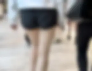 Asian girl in tight black shorts at the mall