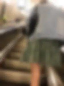 Girl in a Skirt With Thin Legs Standing on a Subway Escalator Low Angle Creepshots Collection