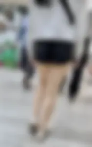 Asian girl in tight black shorts at the mall