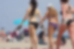 3 sexy girls with nice asses walking on the beach in bikinis