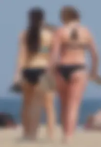 3 sexy girls with nice asses walking on the beach in bikinis