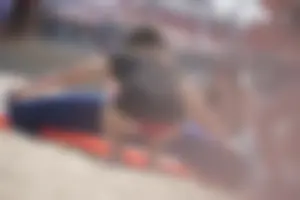 A group of teens in bikinis on the beach
