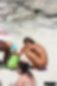 Older lady on a nude beach showing her body