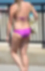Sexy thick blonde girl in purple bikini