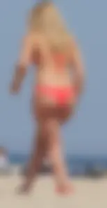 Sexy thick blonde girl with tiny bikini and big booty on the beach