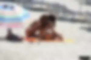 Topless milf and her topless daughter on the beach