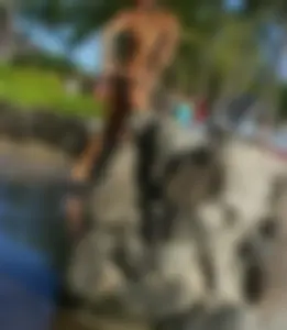 Beach shower girl with cute little ass in tiny black bikini