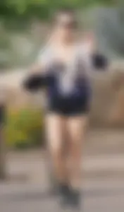 Cutie walking her dog in short denim shorts and showing a bit of cheek
