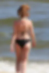 Two sexy beach teens in bikinis, one thick and one skinny with big boobs