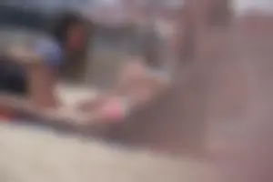 A group of teens in bikinis on the beach
