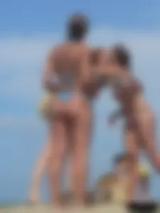 Sexy lady on the beach in a blue thong bikini
