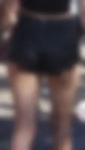 Girl showing some cheeks with a nice ass in pleather shorts