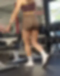 Hot girl in tight shorts bending