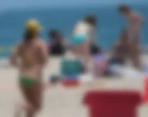 Bunch of sexy babes at the beach in bikinis