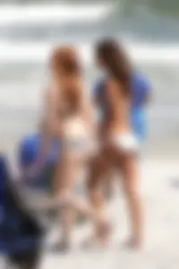 Two cute teens in bikinis