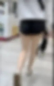 Asian girl in tight black shorts at the mall