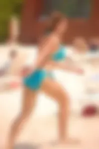 Assortment of sexy babes at the beach in bikinis