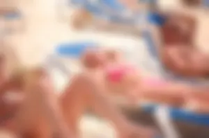 Assortment of sexy babes at the beach in bikinis